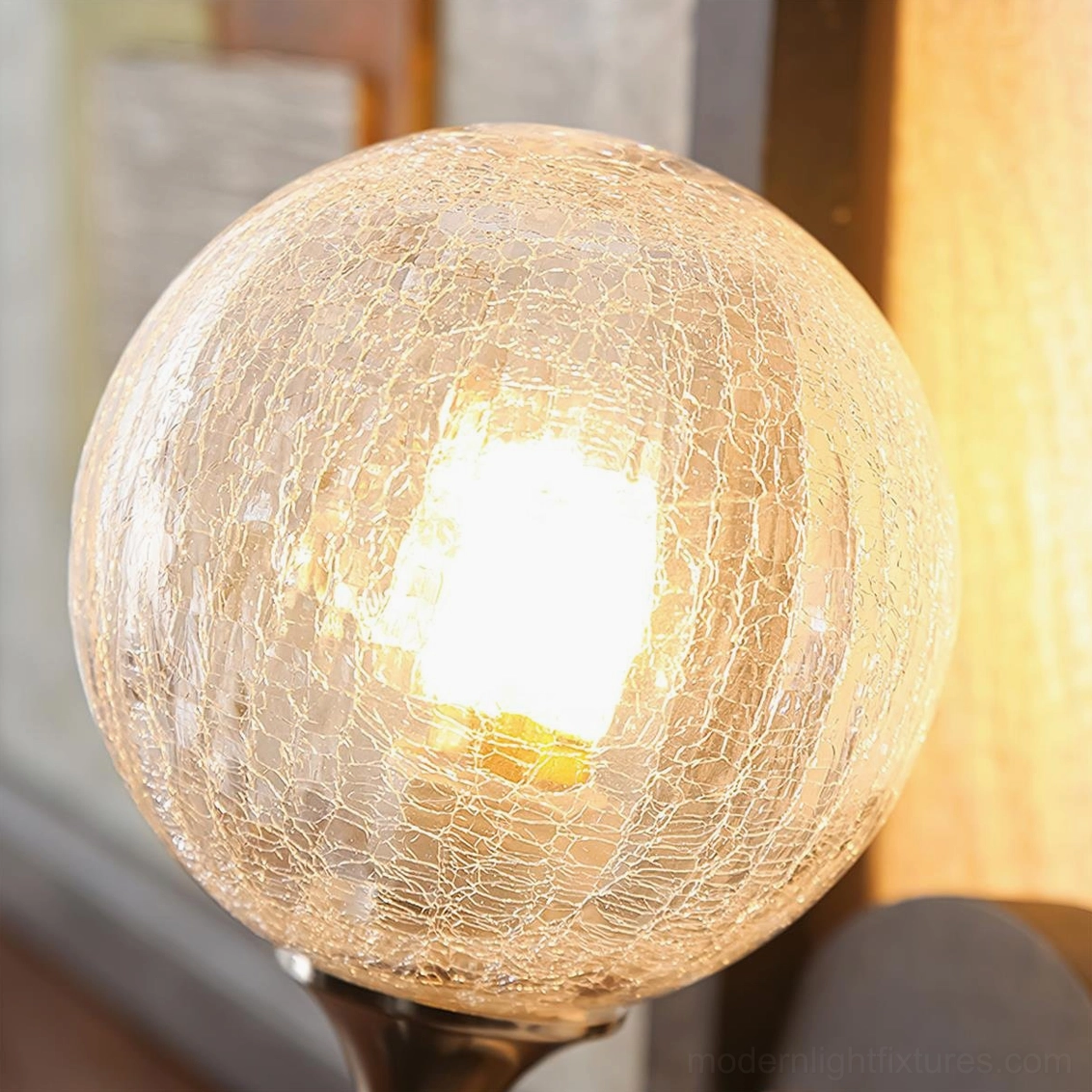 Architectural wall sconce with sculptural spherical frosted glass shade design