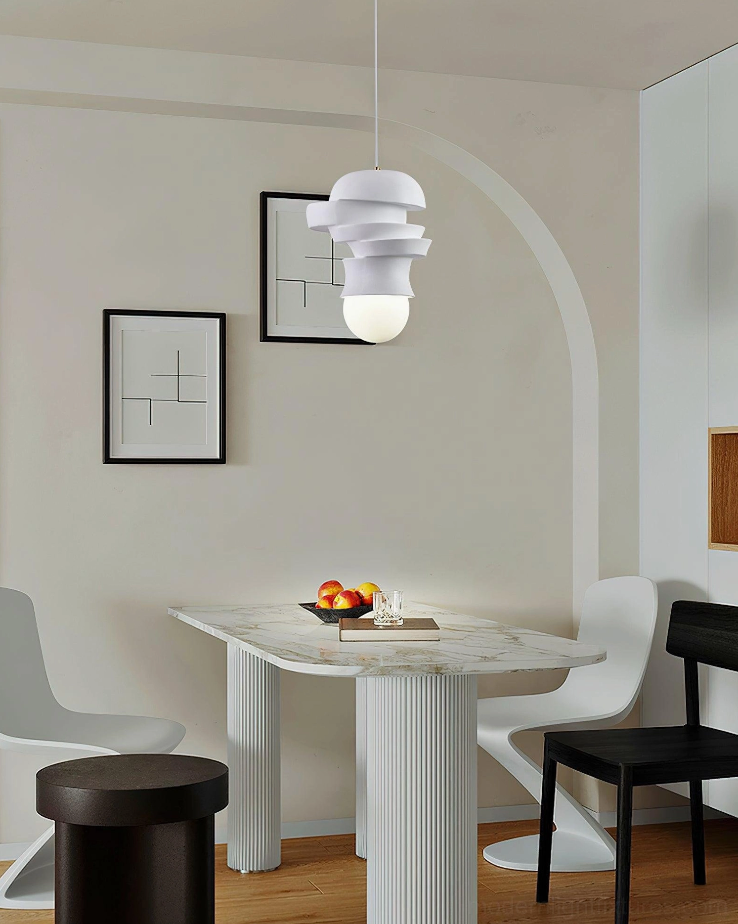 Modern pendant light with stacked white disc shade, architectural view of layered fixture silhouette
