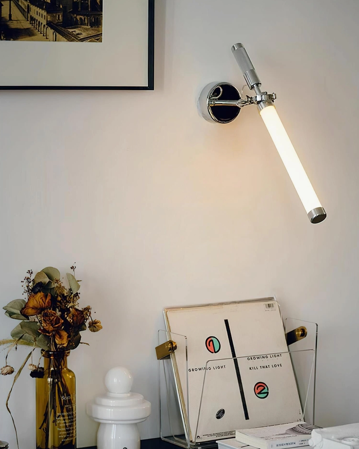 Ariane adjustable swing arm sconce installed in contemporary home corner, creating warm ambient lighting
