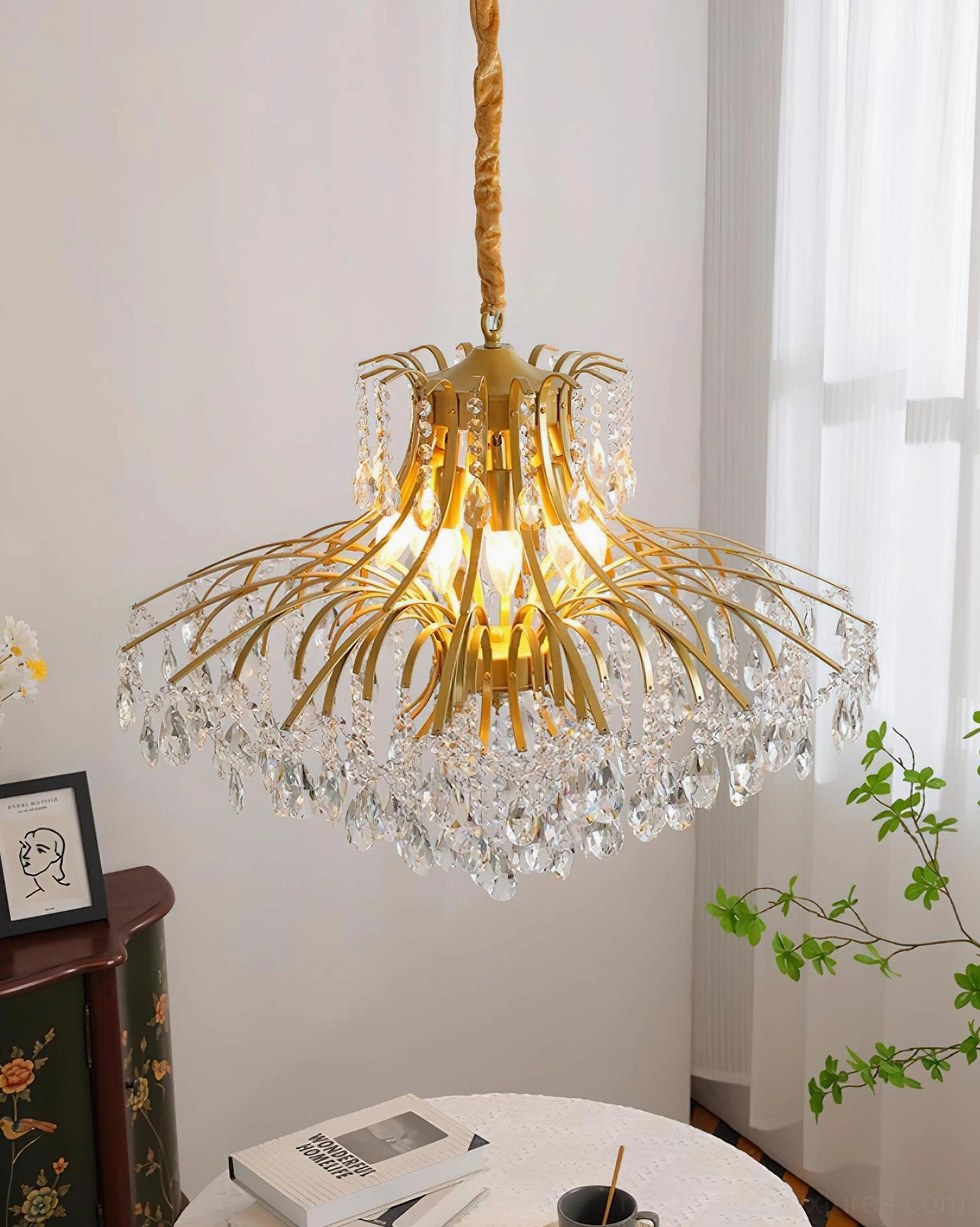 Art deco inspired gold crystal chandelier with geometric precision in cascading droplet arrangement