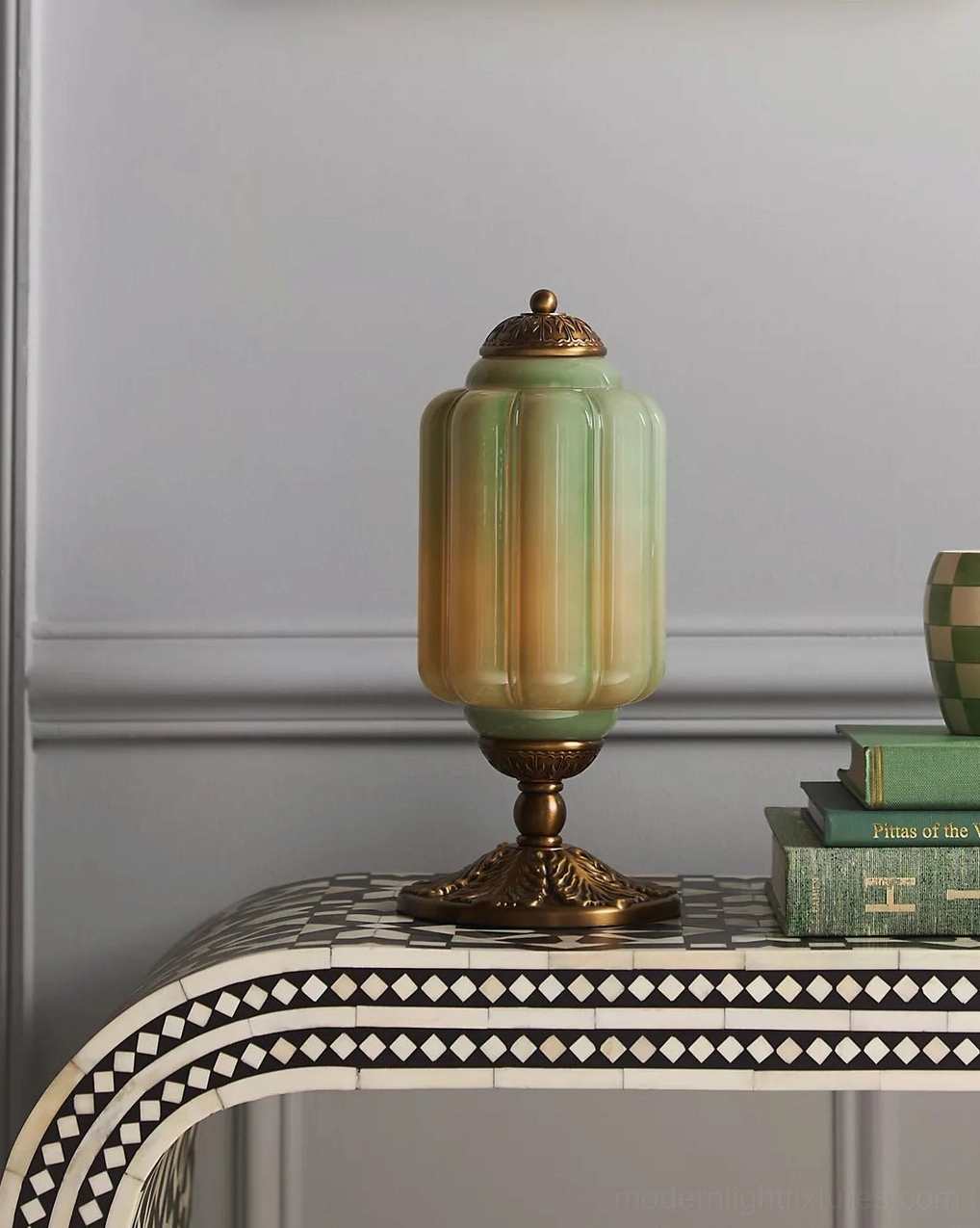 Art Deco inspired fluted glass table lamp with sculptural form and ornate metal base