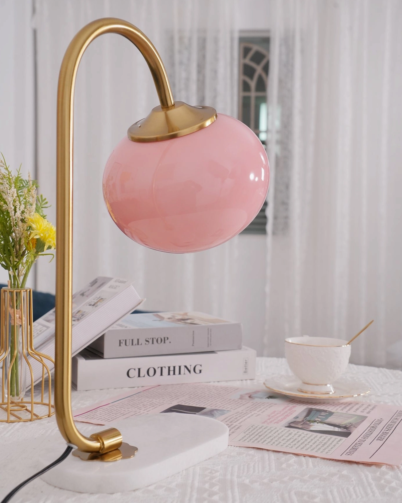 Art deco inspired globe table lamp with geometric shade design and luxe metal frame