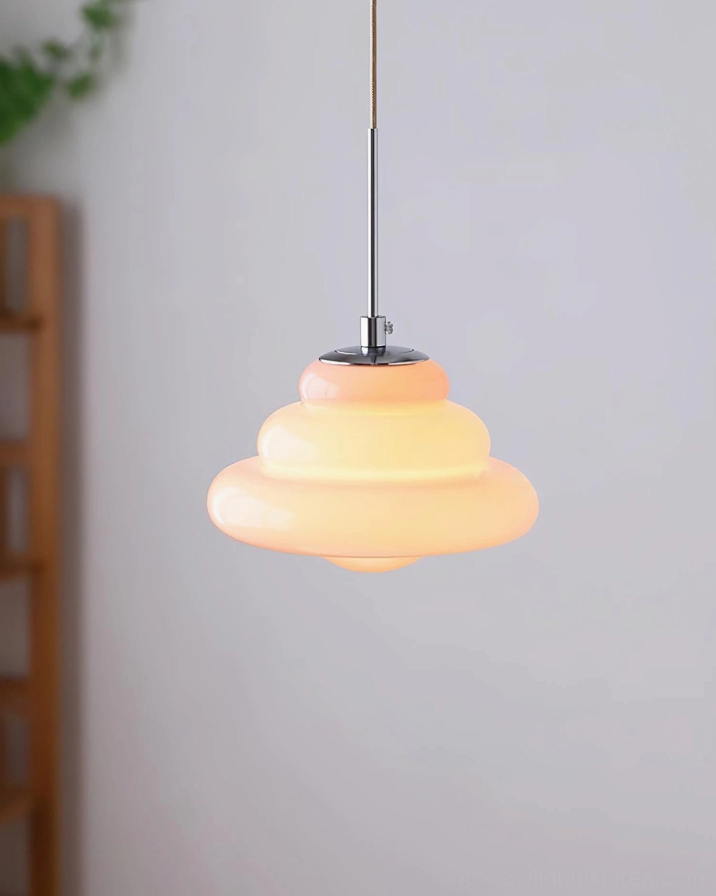Art Deco inspired pendant light fixture with chrome metal components and glass shade