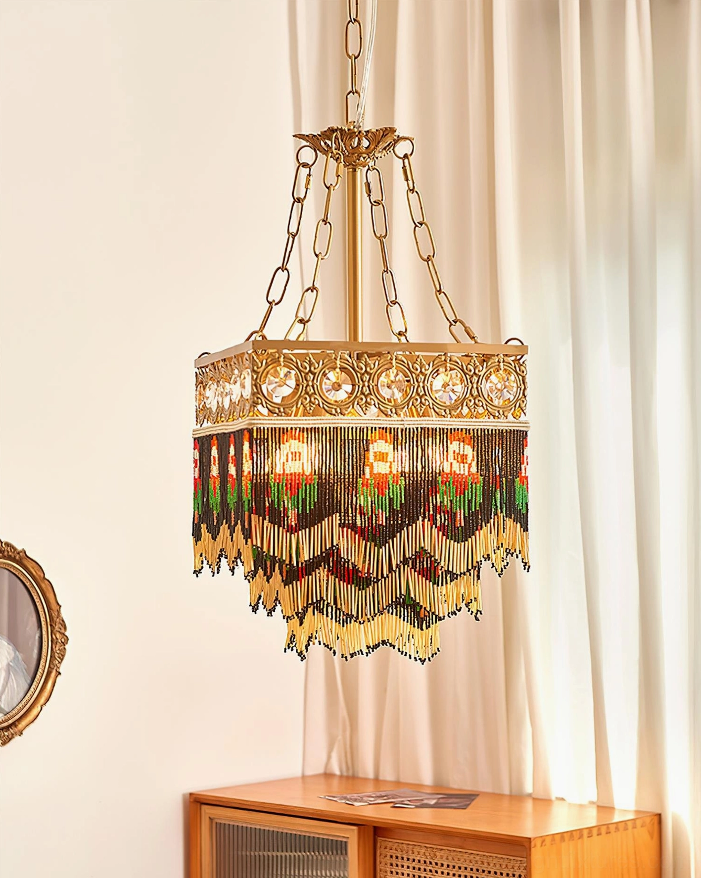 Art Deco inspired tassel pendant lamp with crystal accents and handwoven fringe detailing