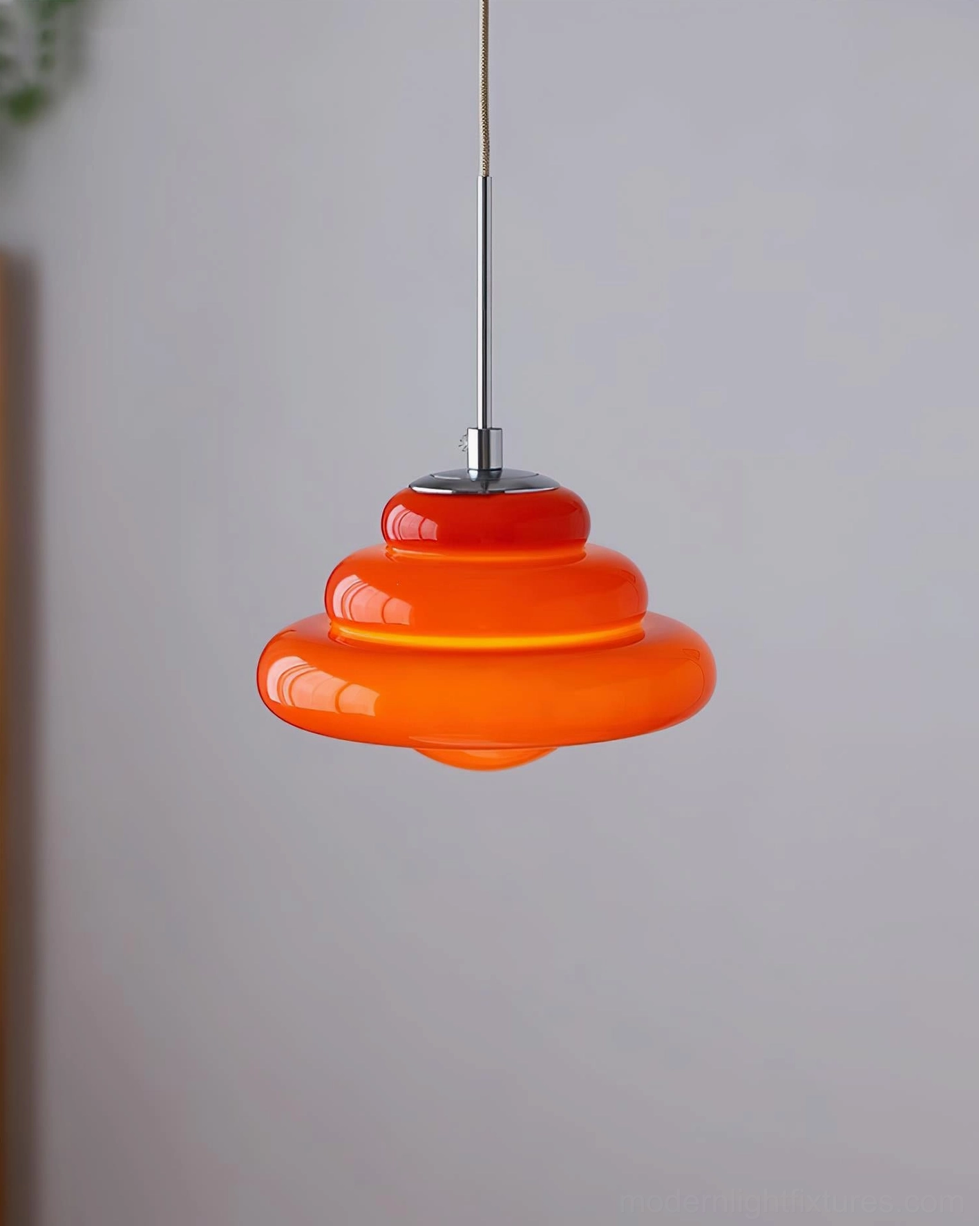 Art Deco tiered hanging lamp creating sculptural focal point in contemporary interior space
