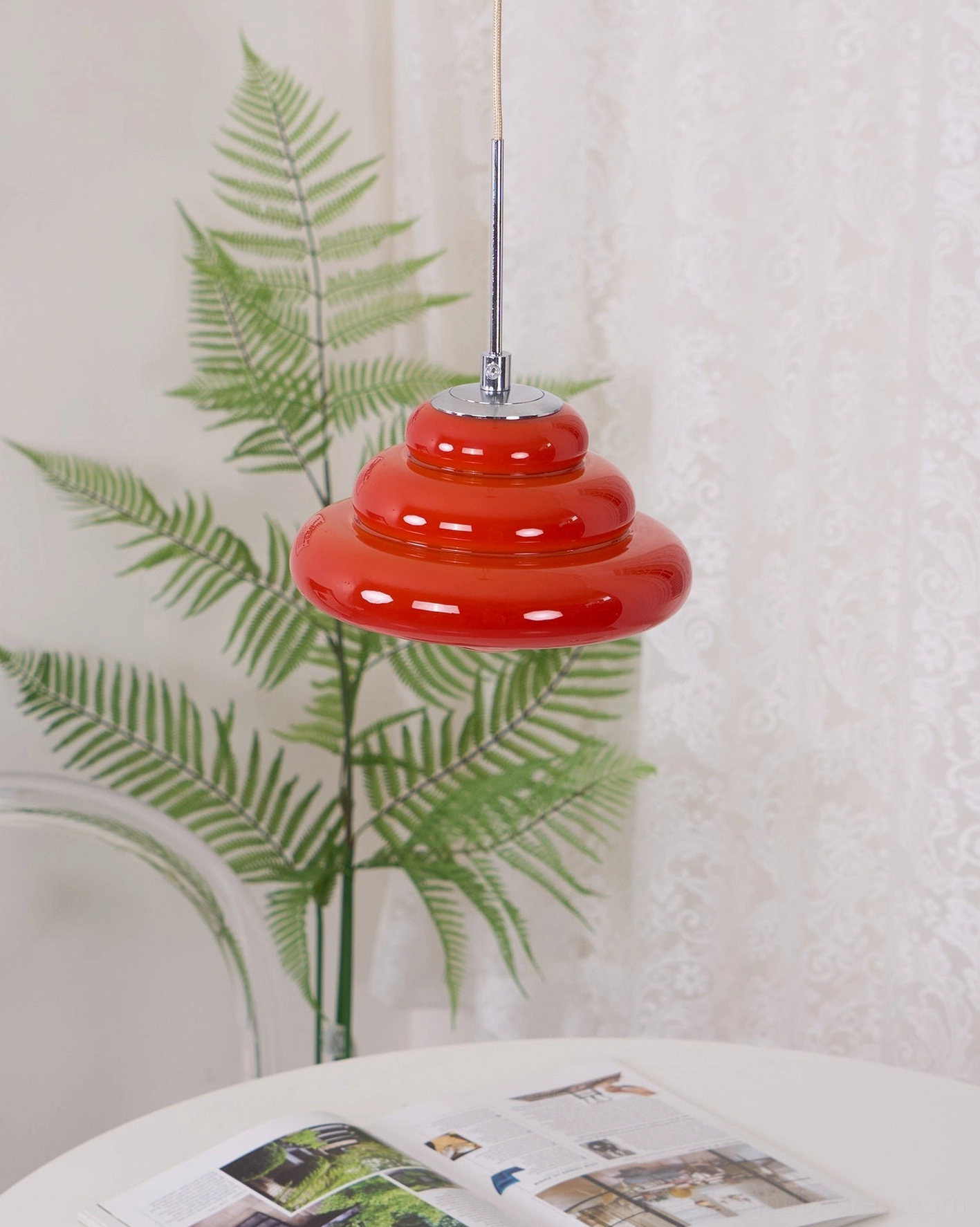 Art Deco inspired tiered pendant lamp creating dynamic light reflection and ambient warmth