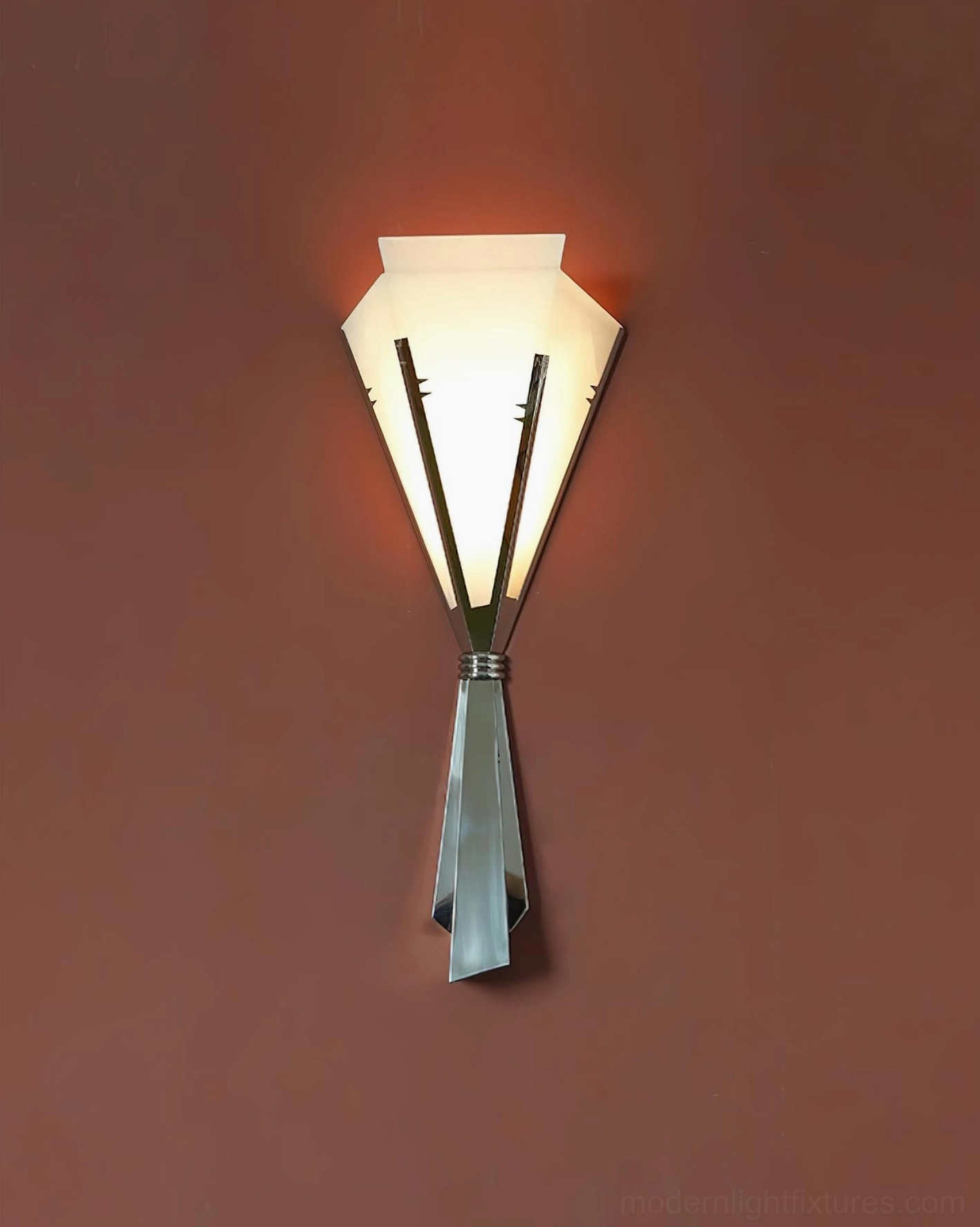 Art Deco wall sconce demonstrating light distribution through alabaster panels creating warm ambient illumination in interior space