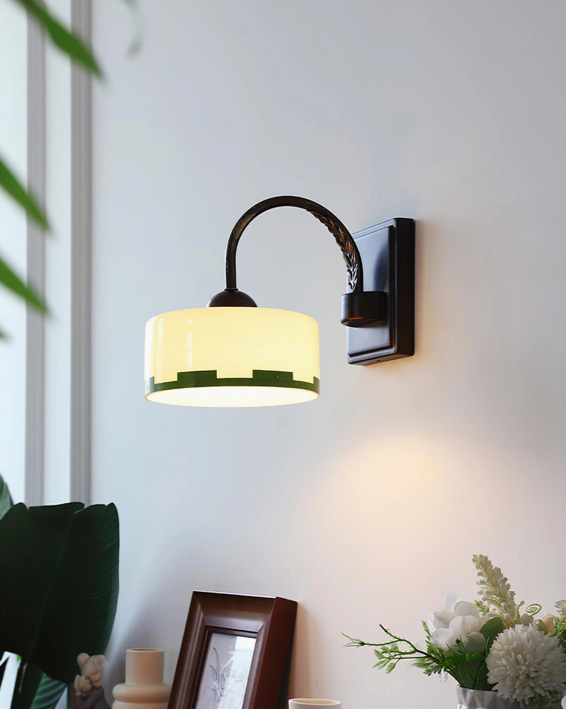 Art Deco green glass wall sconce in modern interior setting, vintage lighting fixture demonstration