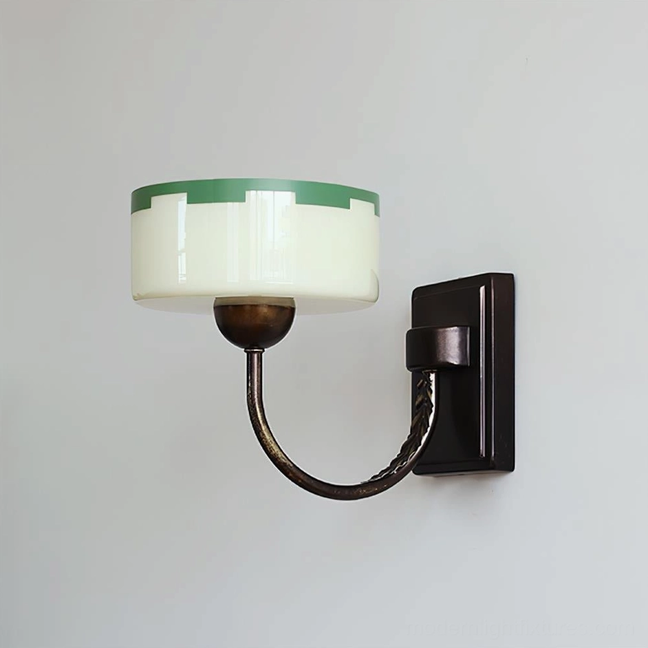 Vintage Art Deco wall sconce with twisted bronze arm and two-tone glass shade on white background
