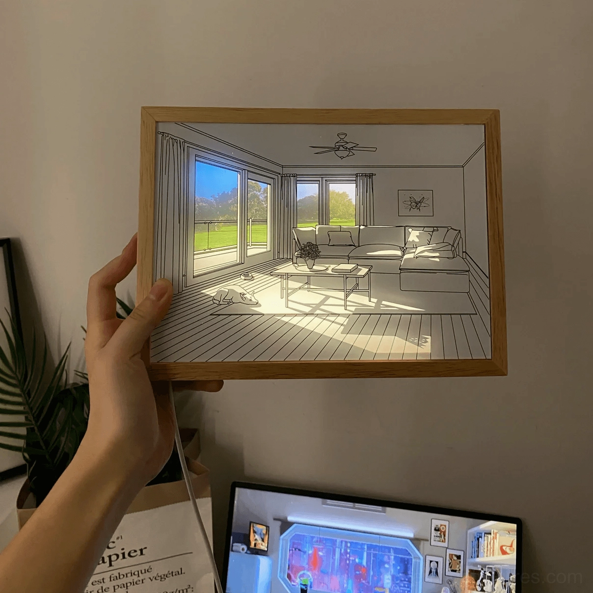 Modern LED art wall fixture showing light wood frame and acrylic panel detail side view
