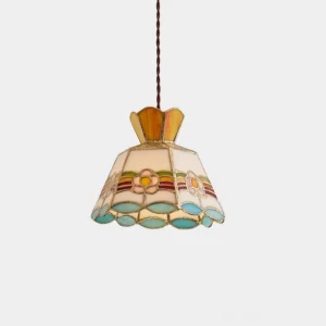 Art Nouveau stained glass pendant lamp with yellow, pink, and aqua blue glass panels and brass filigree leading in studio