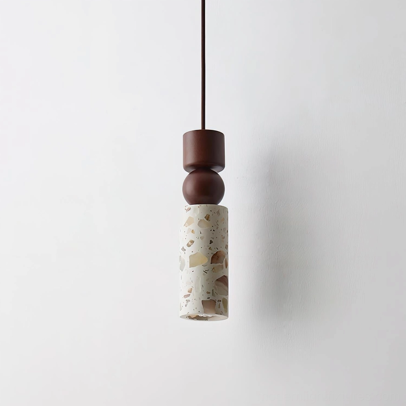 Artena pendant lamp demonstrating geometric light diffusion and terrazzo material craftsmanship details