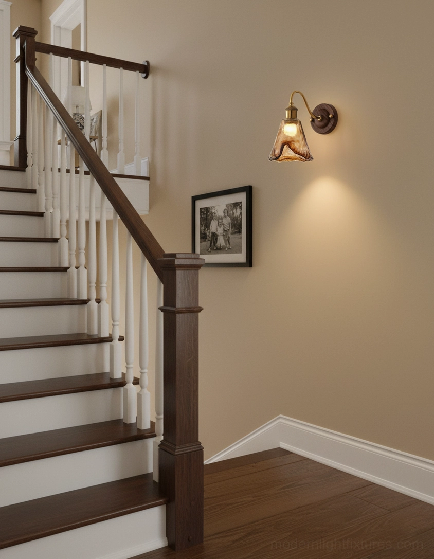 Artisan amber glass wall sconce detail emphasizing hand-rippled surface and light-catching properties