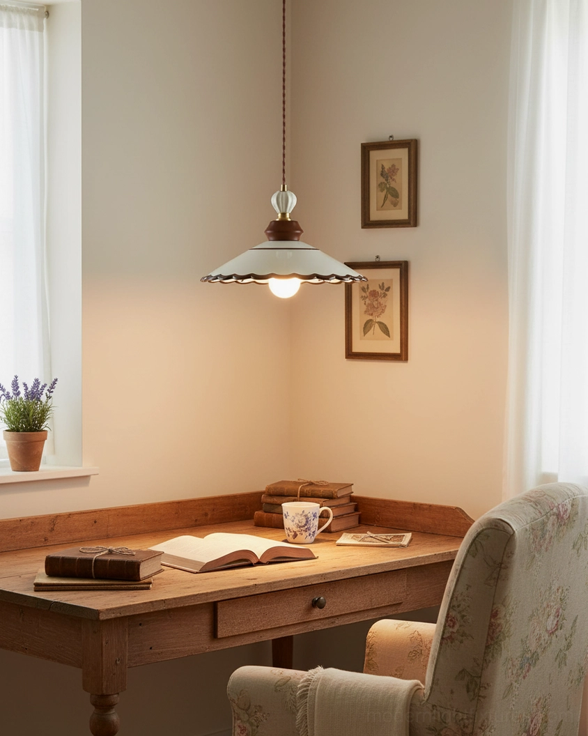 Artisan ceramic pendant light with scalloped edge and warm ambient lighting in residential interior space