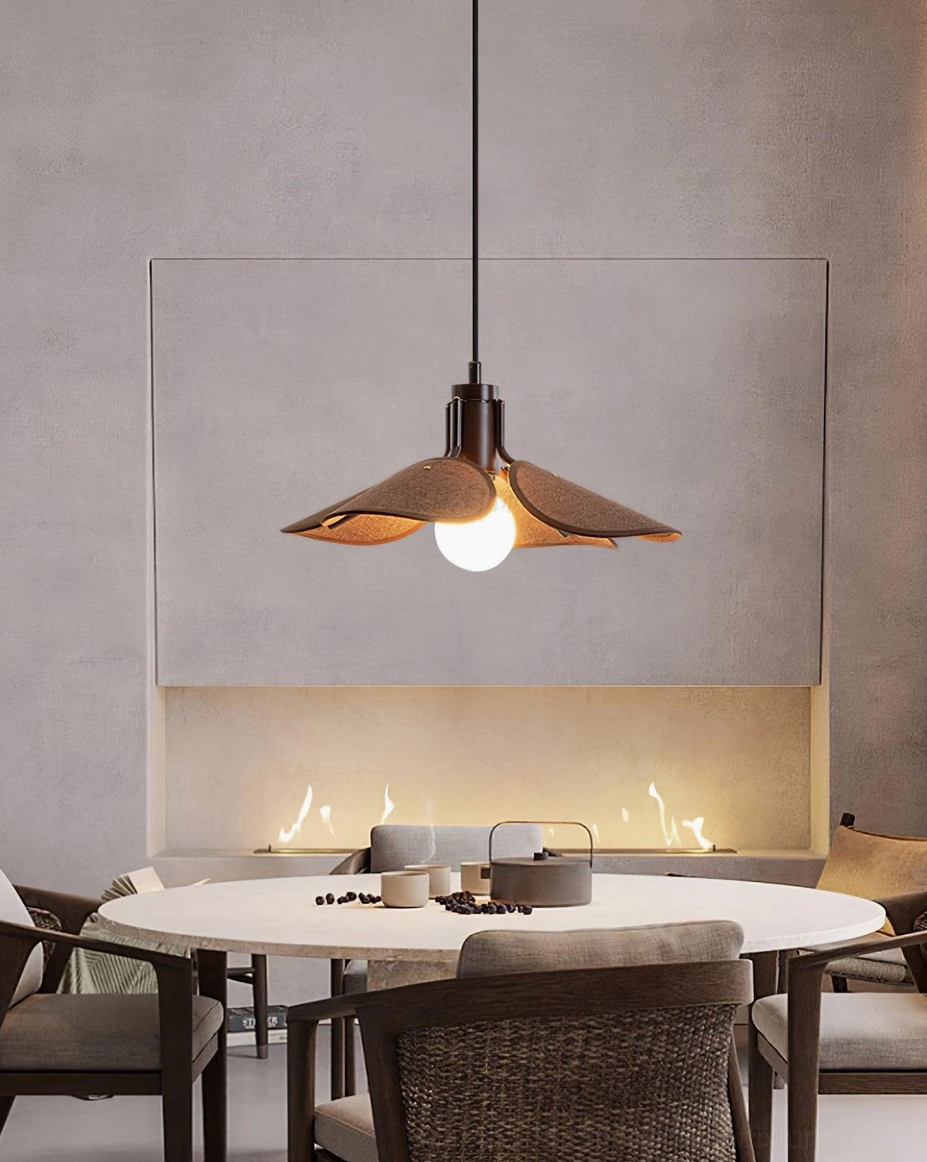 Artisan rattan ceiling pendant with warm glow creating cozy atmosphere in residential space