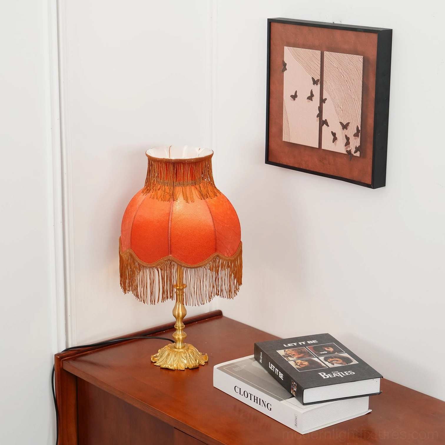 Artisan-made tassel table lamp with ornate brass base and premium decorative fringe