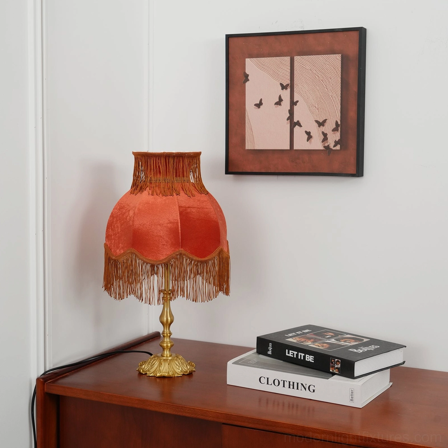 Artisanal brass tassel table lamp with decorative fringe and premium fabric construction