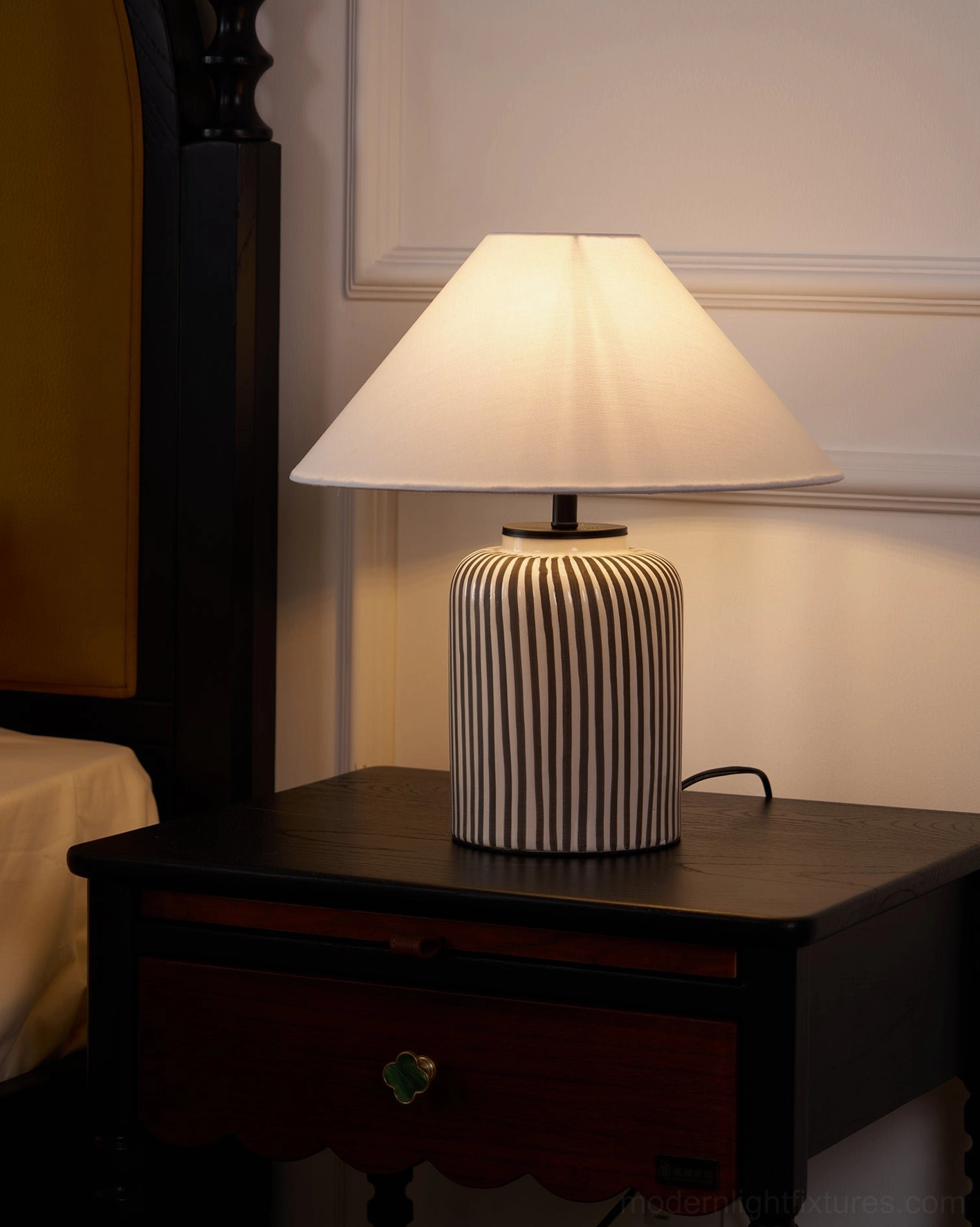 Hand-painted striped ceramic lamp base featuring authentic artisanal craftsmanship and texture