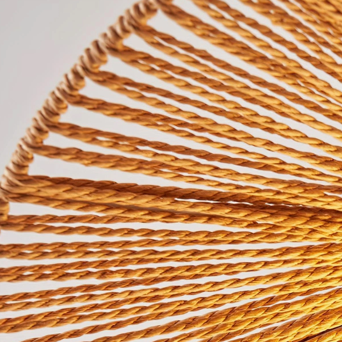 Artisanal rattan pendant light showing organic weaving pattern and contemporary design aesthetic