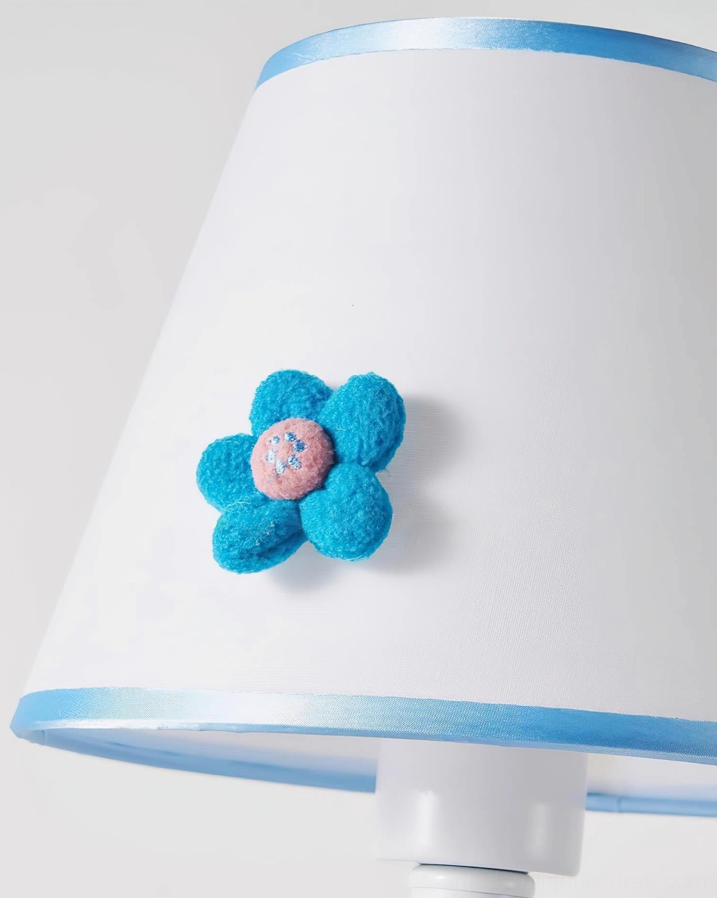 Artisanal ceramic table lamp with handcrafted felt flower embellishment - artistic lighting solution