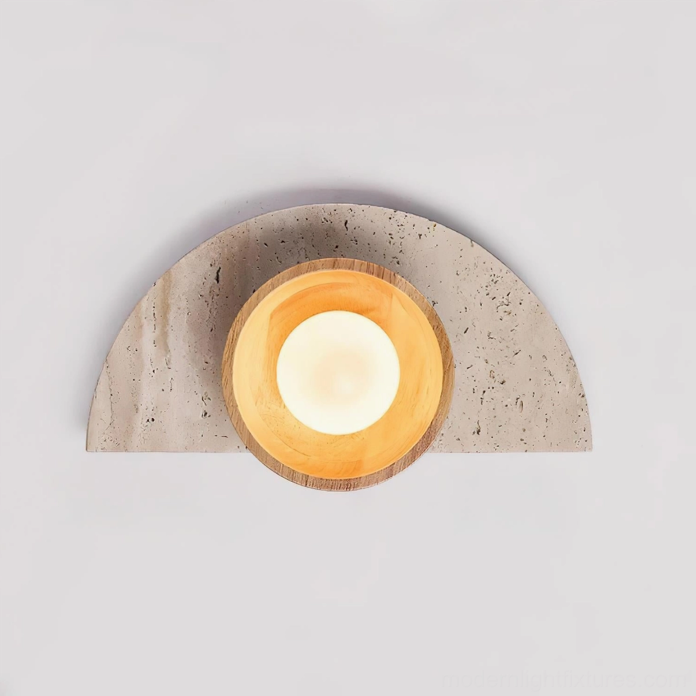 Modern travertine and wood wall sconce showing artisanal craftsmanship and minimalist aesthetic in home interior