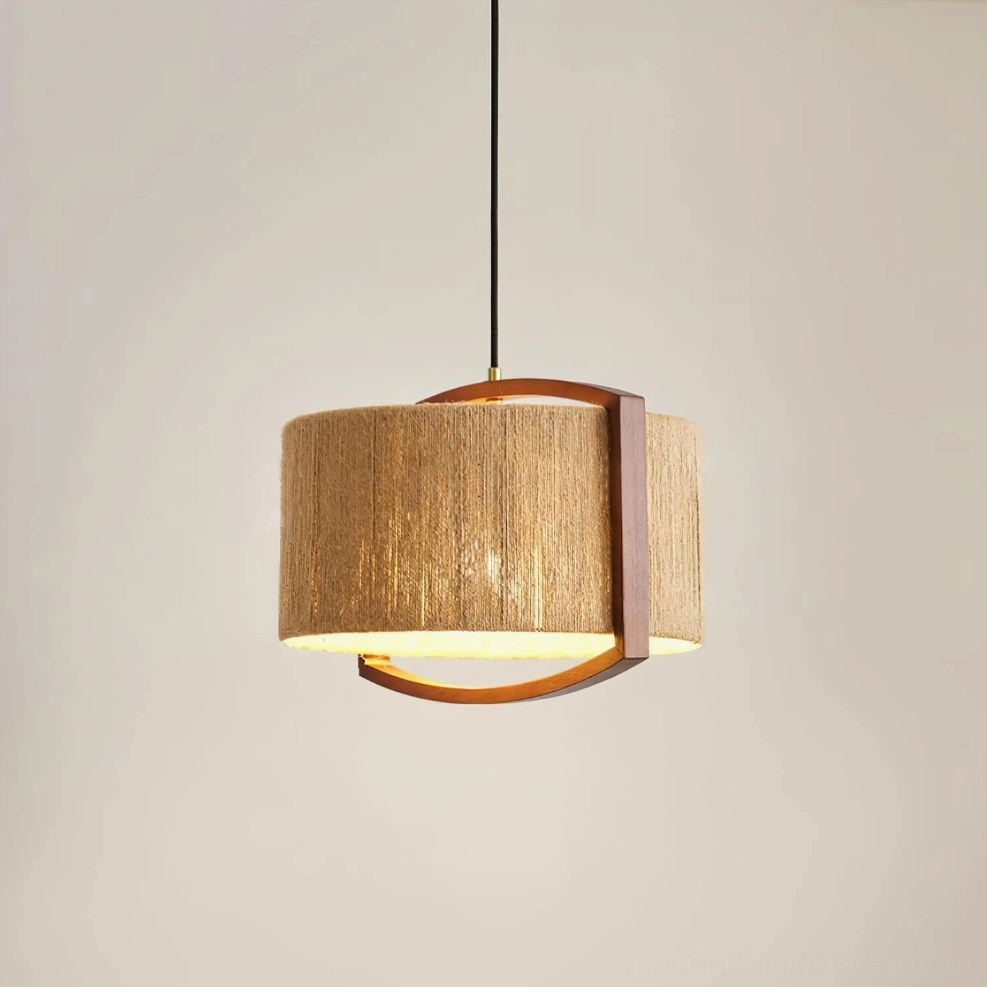 Handwoven jute pendant light with dark walnut wood frame, three-quarter view against warm wall