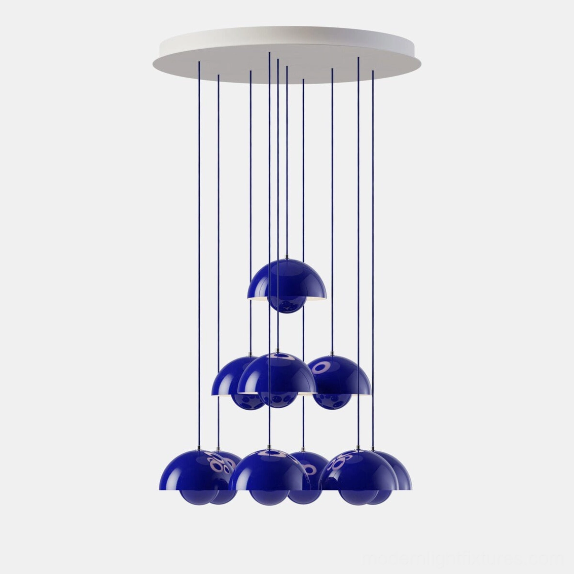 Artistic dome pendant chandelier with hemispherical shades arranged at varying heights creating dynamic visual effect