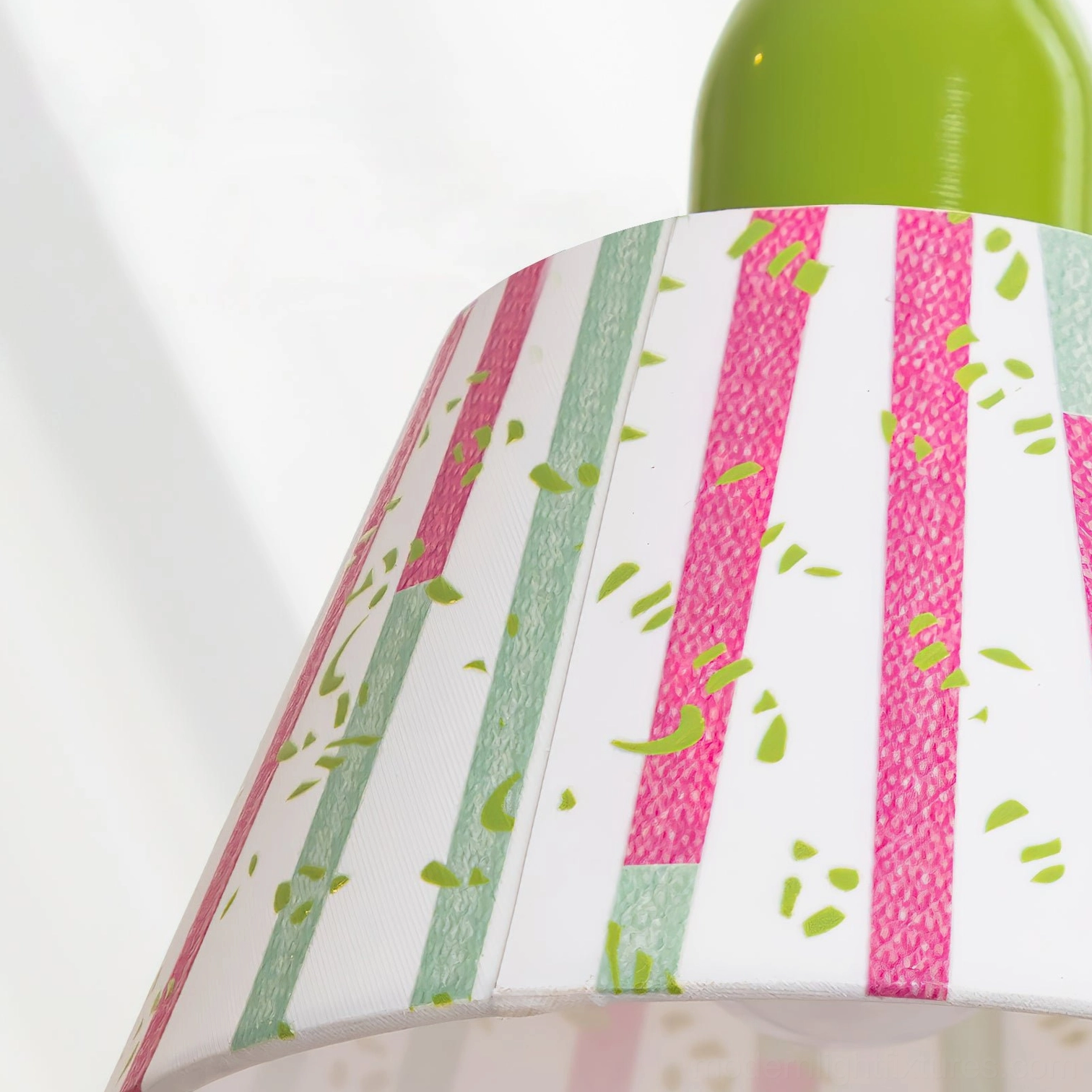 Artistic swing arm table lamp featuring hand-painted green and pink vertical brush stroke shade pattern