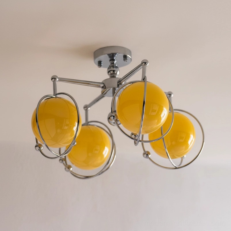 Artistic orbital ceiling lamp fixture showcasing sculptural chrome frame and spherical glass design