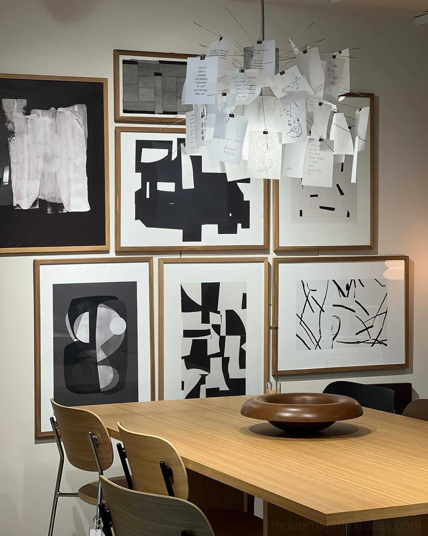 Paper card pendant light low-angle view showing white paper cluster arrangement in framed art dining room