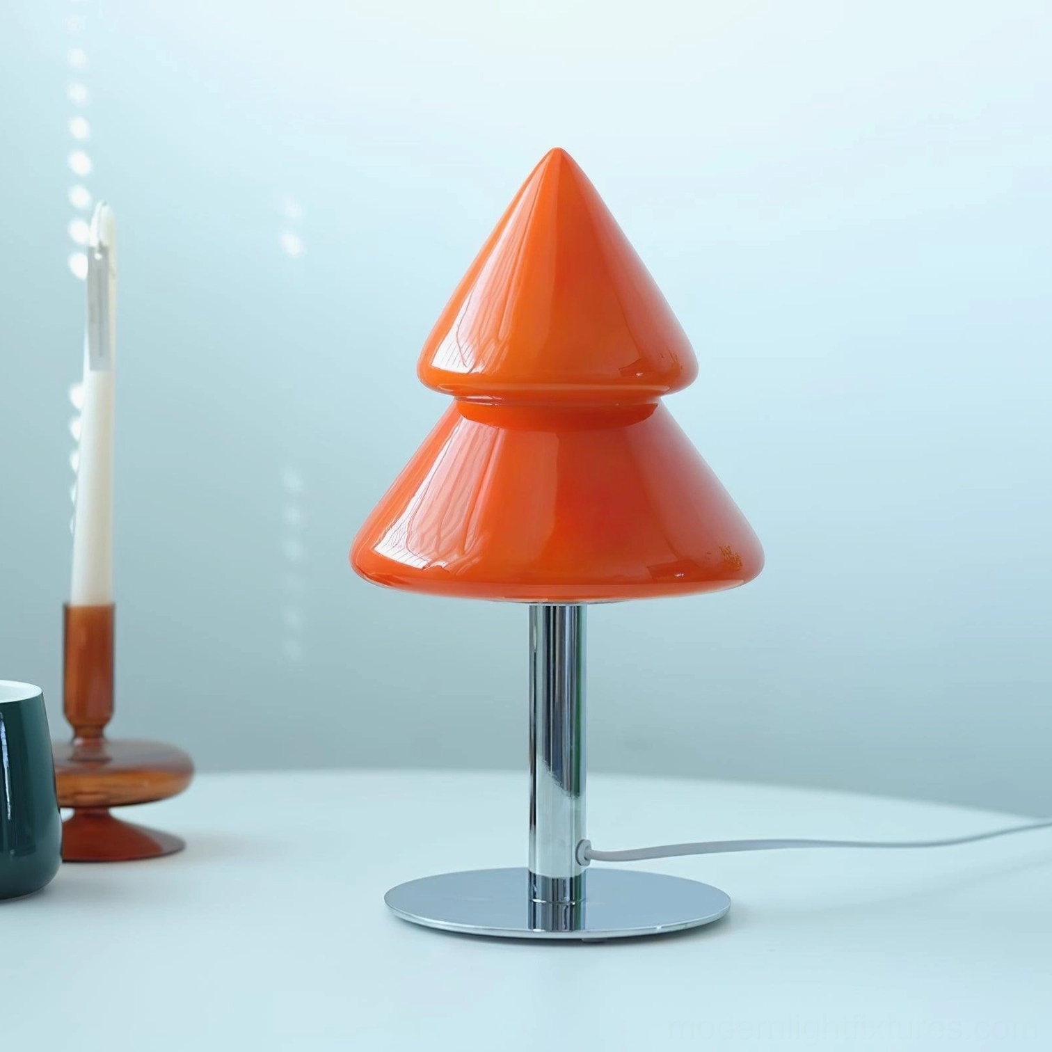 Artistic photography of modern Christmas tree lamp showing sculptural glass shade