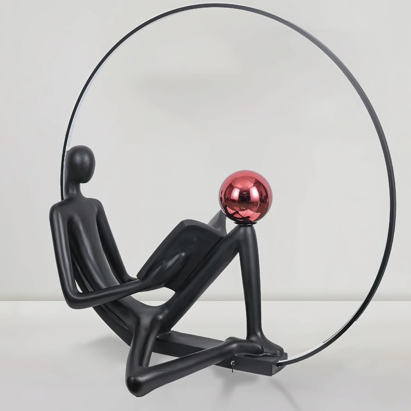 Artistic reading figure floor lamp, black resin sculpture with red sphere, modern home decor lighting