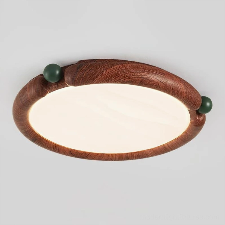 Round wood-grain ceiling light fixture artistic detail, green decorative sphere accents