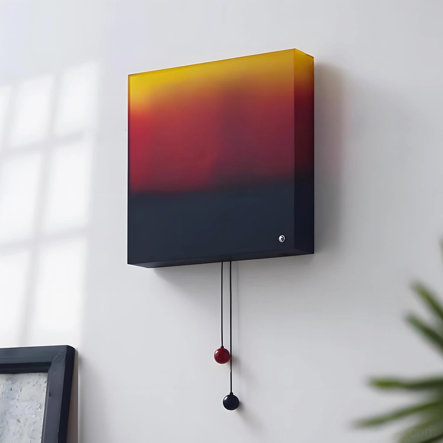 Modern artistic wall sconce with rich sunset color gradient creating dramatic ambient room lighting