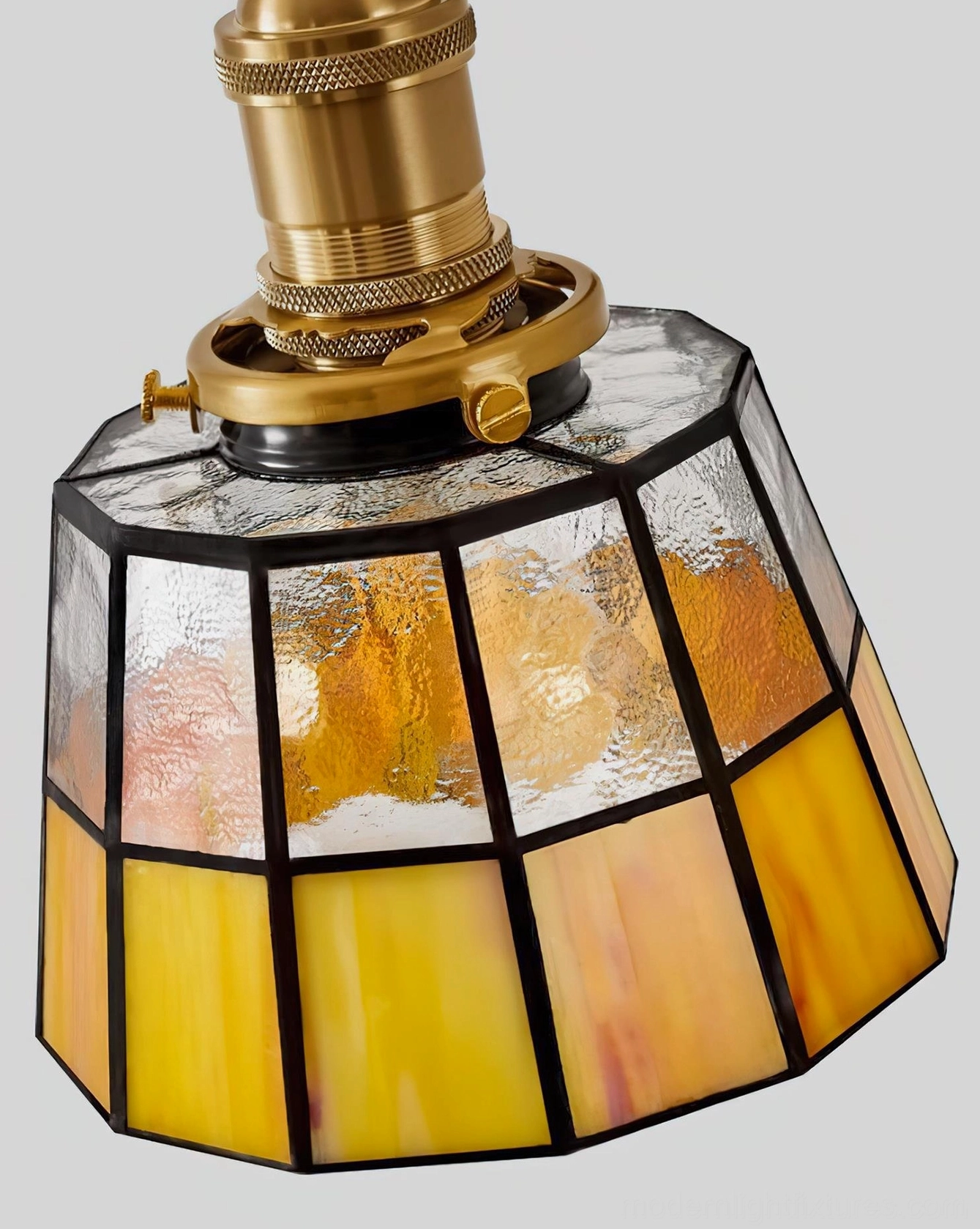 Arts and Crafts style wall-mounted stained glass sconce with walnut wood frame and antique brass in period interior, celebrating handmade artisan quality