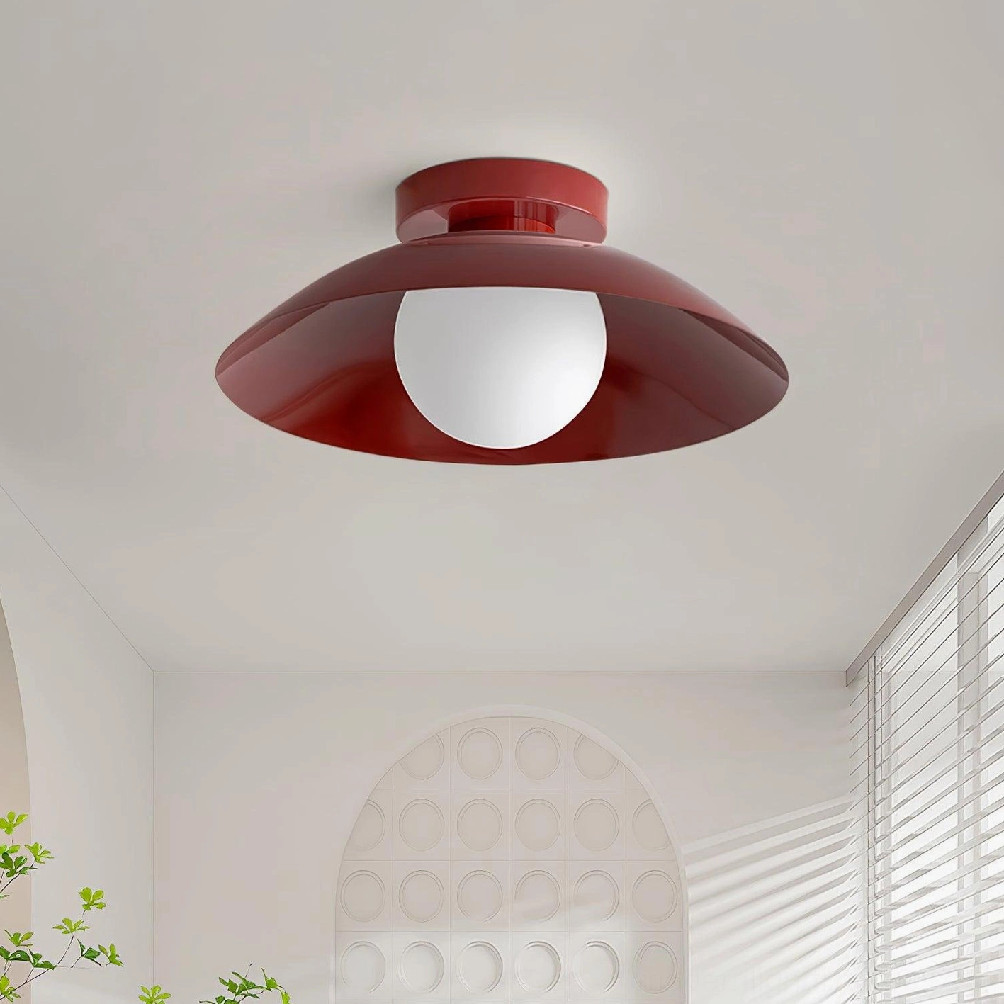 Modern Arundel Orb ceiling light installed in minimalist hallway with white ceiling and louvered window