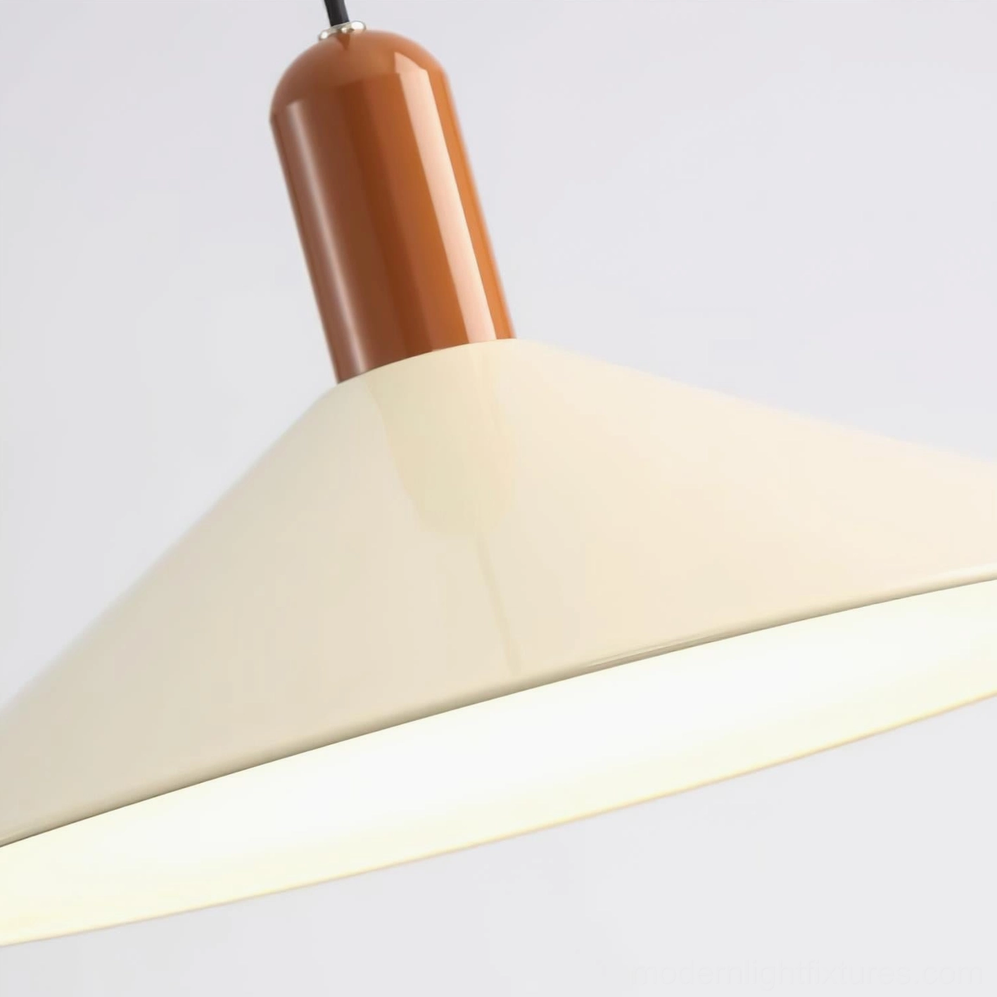 Arundel minimalist pendant lamp lit ambient view, cone shade casting soft warm glow in interior