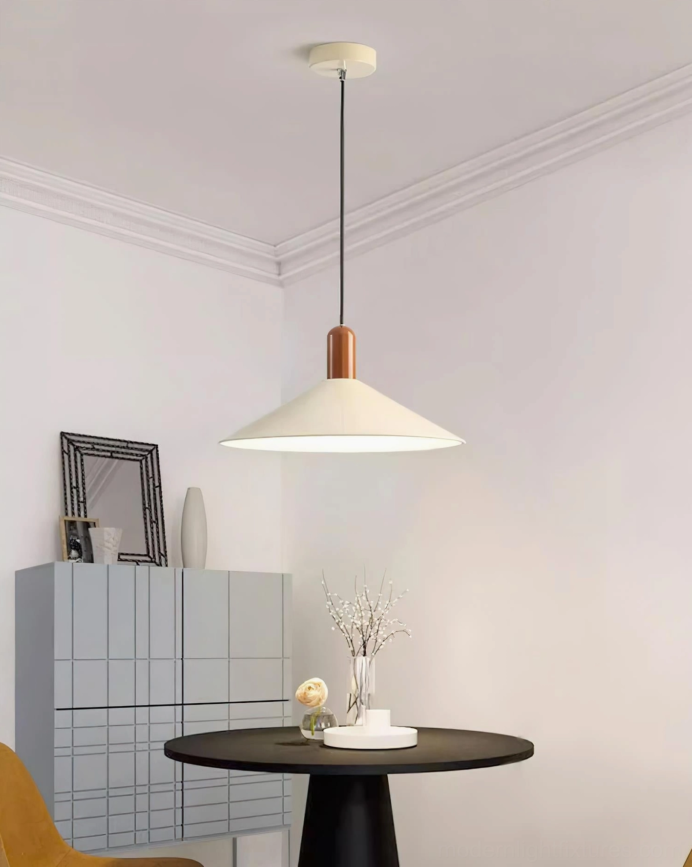 Arundel minimalist pendant light in small modern dining corner, neutral tones with off-white shade and wooden cap