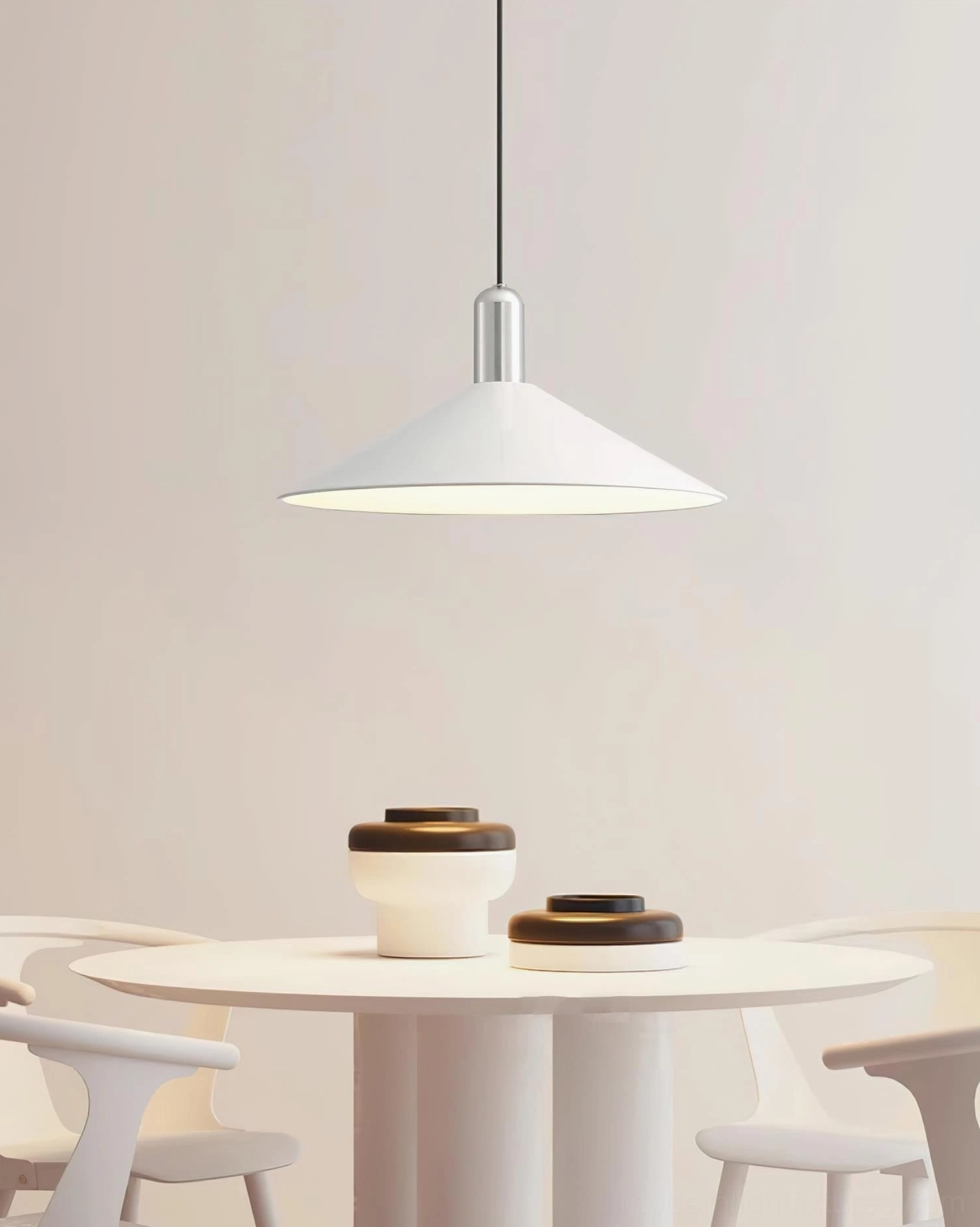 Arundel modern cone pendant light above round dining table, contemporary minimalist white shade with silver mount