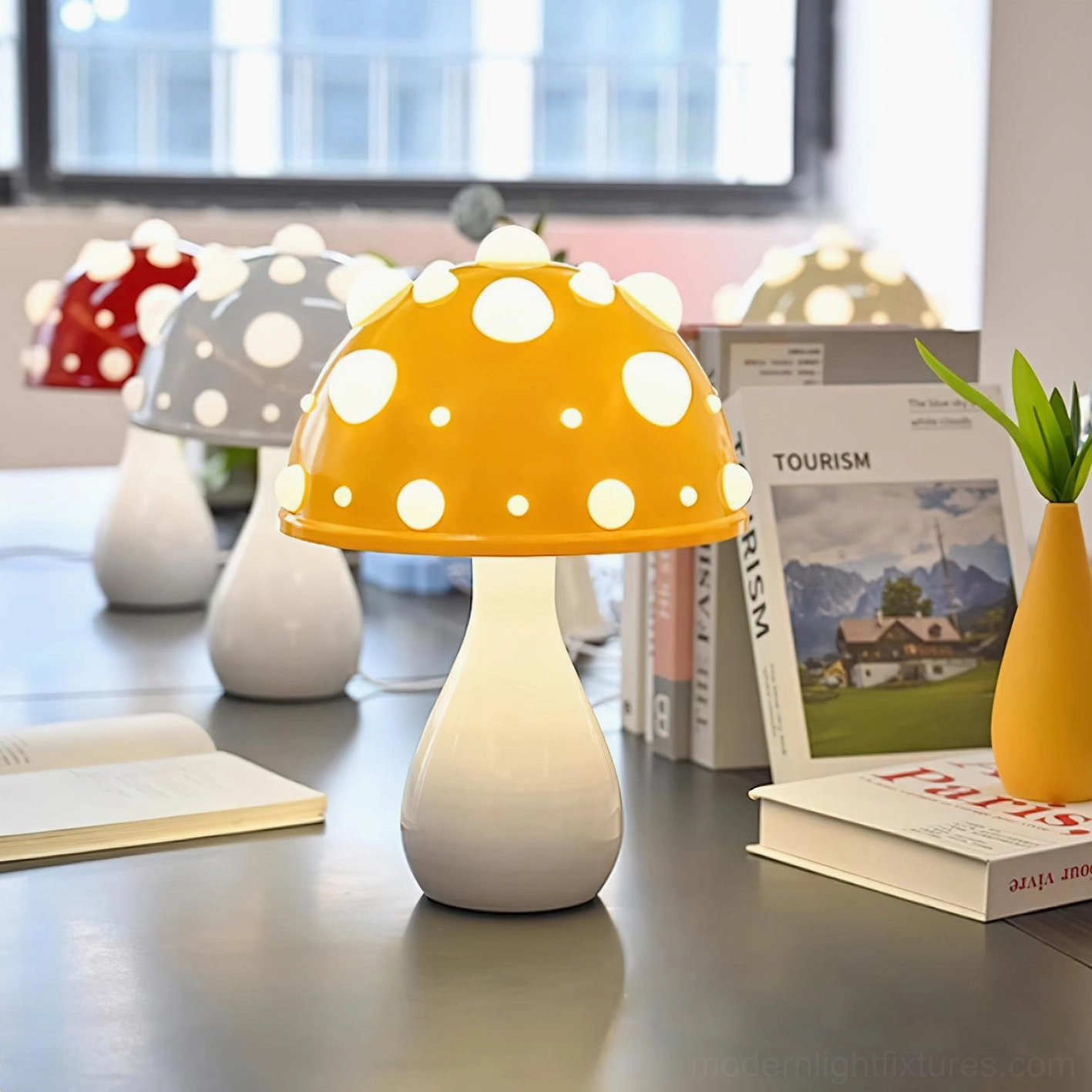 Assorted color mushroom table lamps collection in multiple colors with glowing caps, overhead desk view in office study space