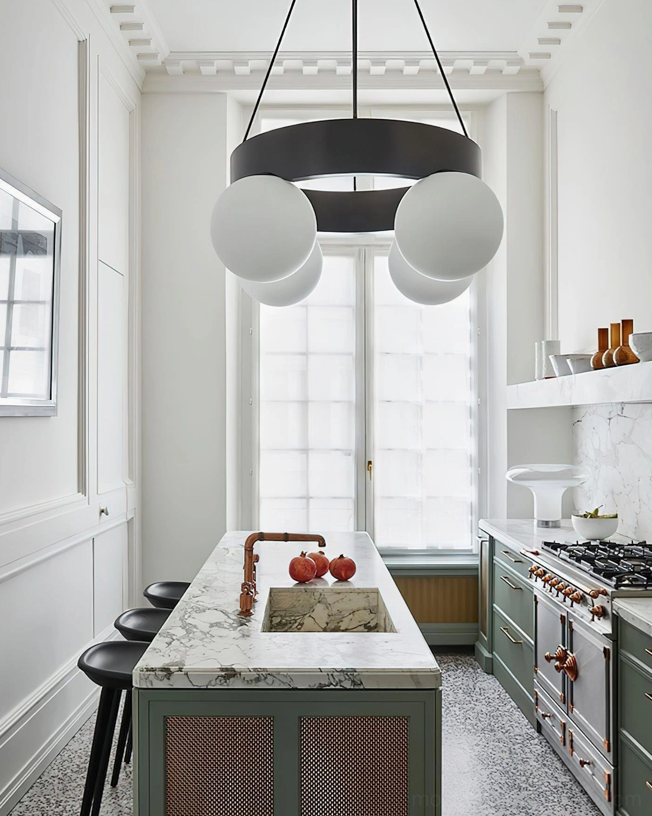 French country kitchen with black ring globe chandelier over marble countertop and dining area