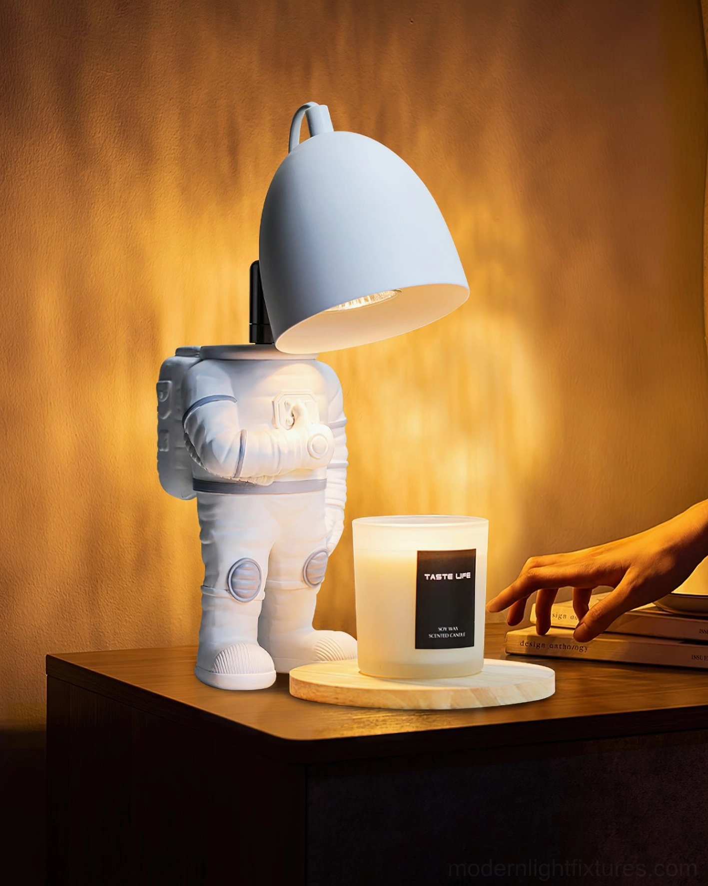 Astronaut candle warmer table lamp product showcase with modern minimalist design and dual functionality