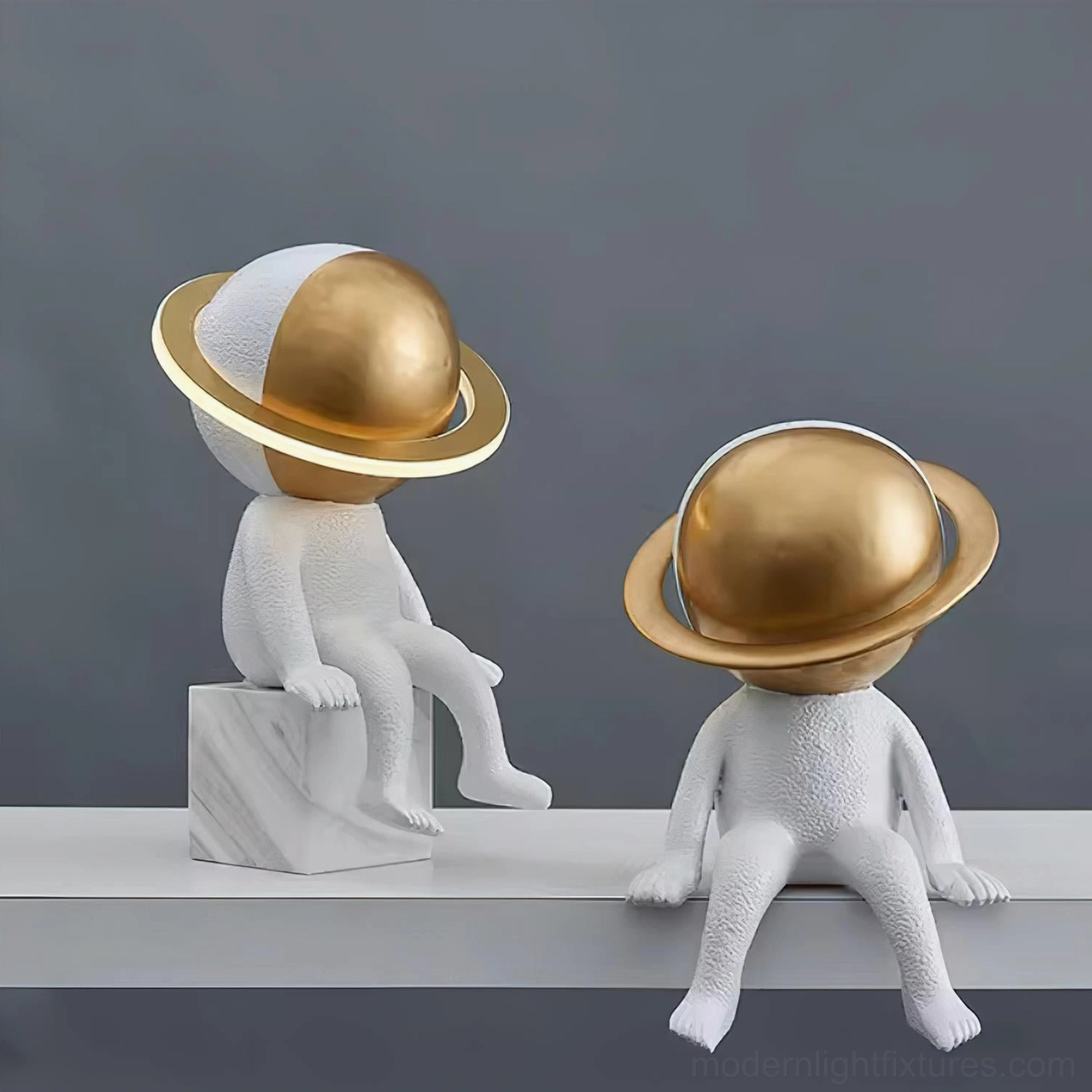 Modern astronaut table lamp sculptural design detail showing resin body and brass metallic ring