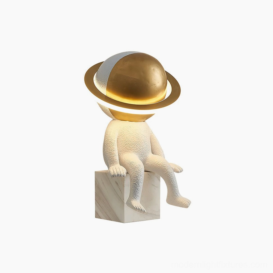 Astronaut Halo LED lamp front three-quarter angle with half brass half white planet orb on white studio background