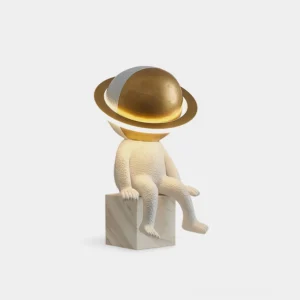 Astronaut Halo LED table lamp front three-quarter view with golden orb ring and marble base on white background