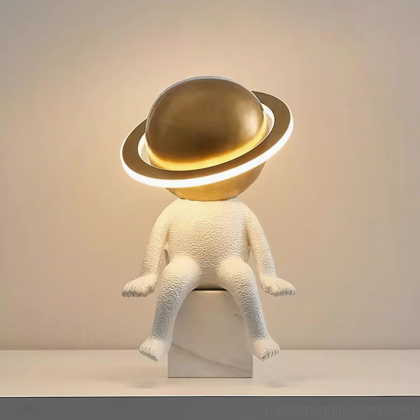 Modern astronaut table lamp illuminated on shelf with warm ambient glow and textured white resin body
