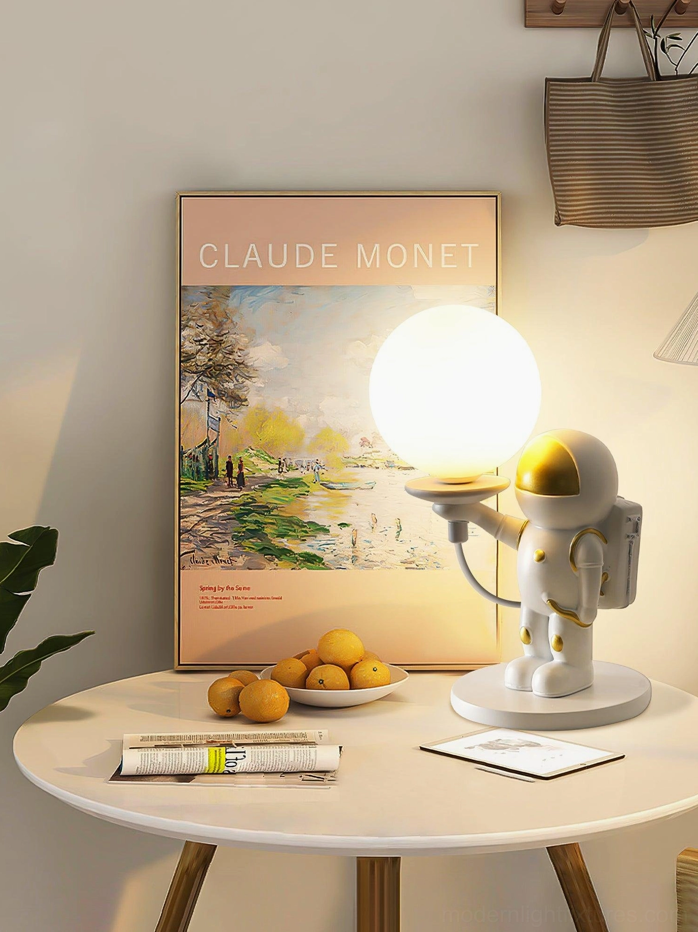 Astronaut spherical table lamp with warm LED glow and white figurine