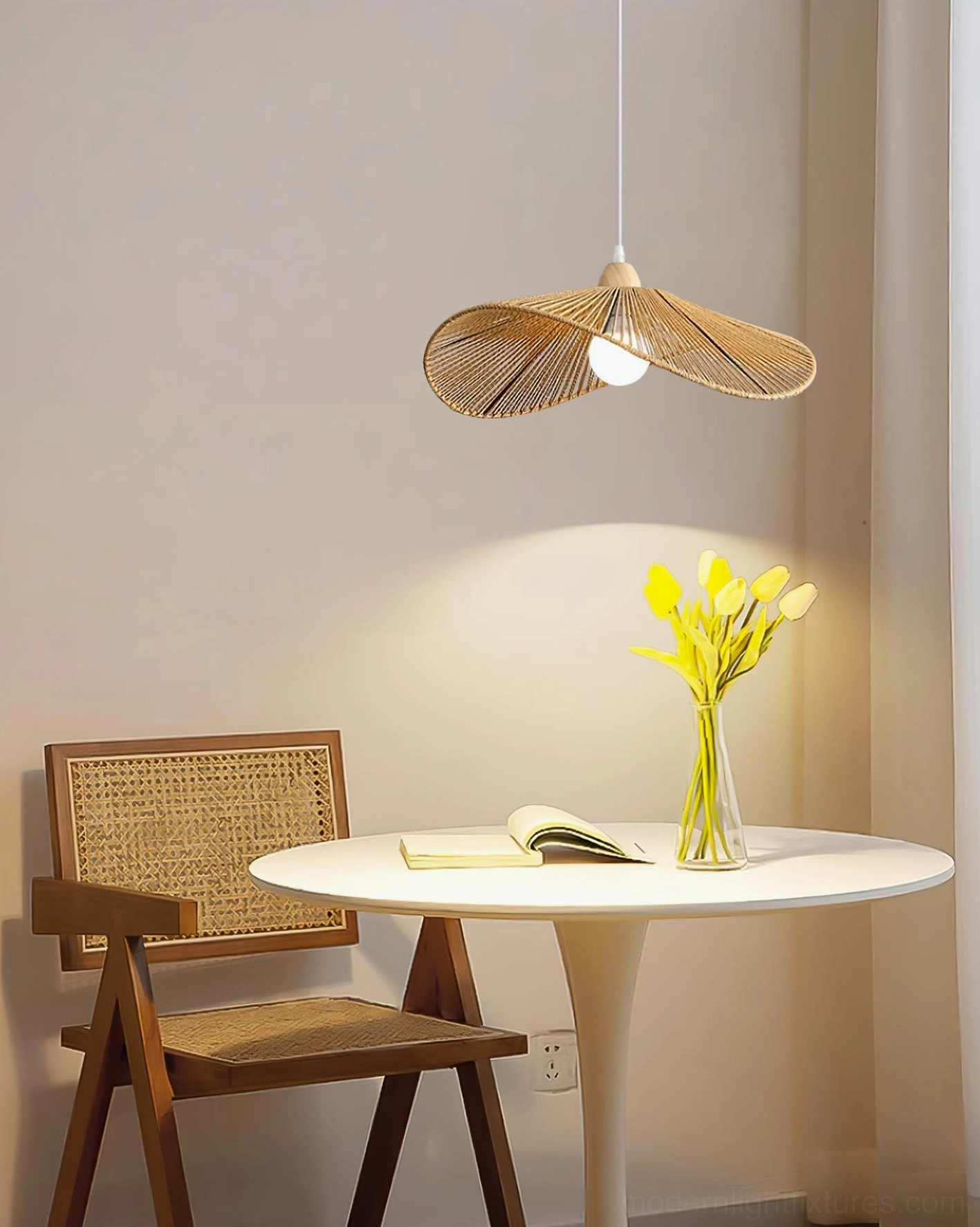 Asymmetrical rattan pendant lamp shade detail highlighting natural woven petal design elements