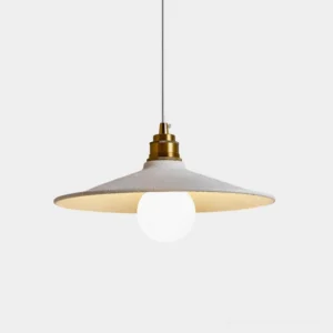 Aura Bell pendant light with white fabric dome shade and brass metallic fixture, studio front view showcasing minimalist industrial design