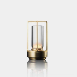 Aura Gleam cordless LED table lamp with gold aluminum frame and clear glass shade, front view minimalist studio display